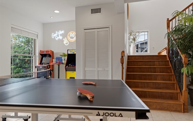 Large game area with Ping Pong table and Arcade games for endless fun times!
