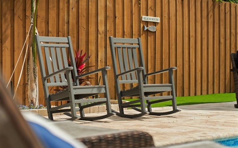 Relax in these outdoor rocking chairs by the pool