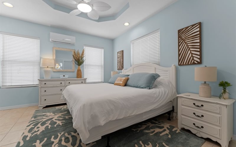 Main Floor King Bed, dresser, double nightstands, smart TV and closet for a comfortable stay.