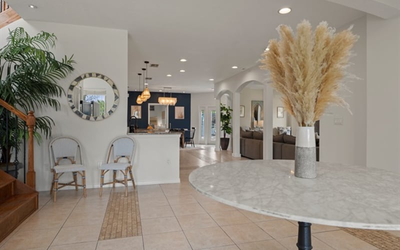 Grand, open entryway warmly invites you into the home.