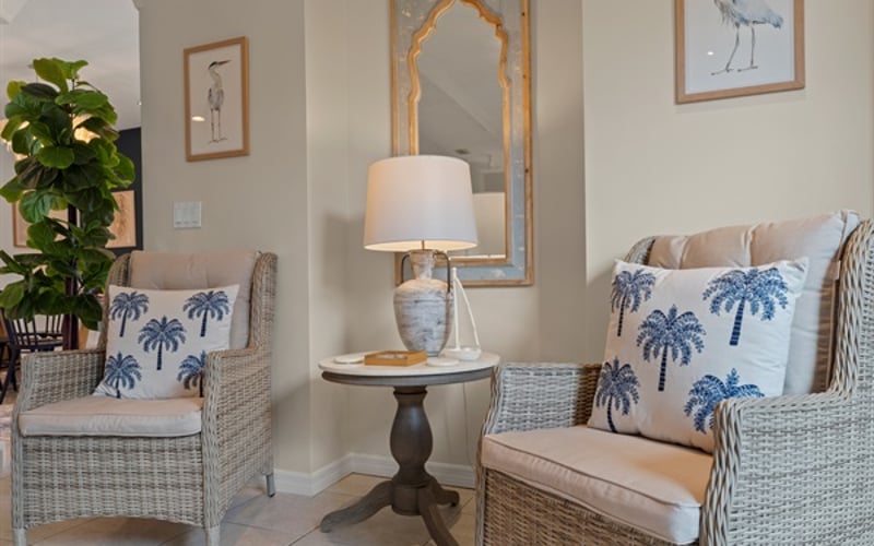 Cozy wicker chairs in living room provide additional seating options